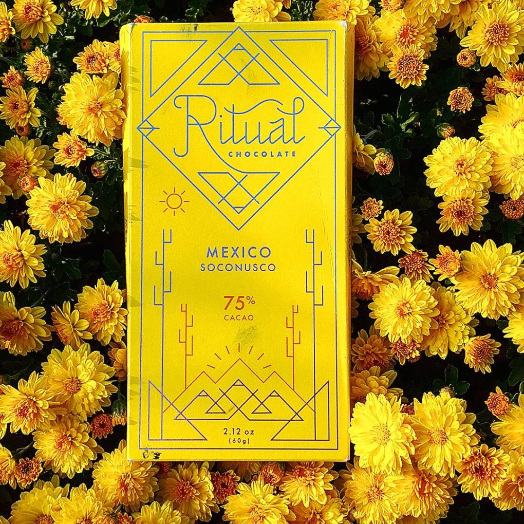 ritual soconusco mexico 75 dark chocolate bar flowers front of bar